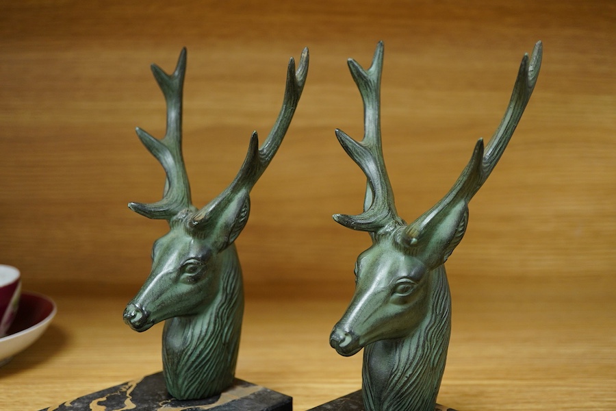 A pair of French bronzed stags head bookends, 19cm high